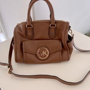 Michael Kors leather handbag, with shoulder strap and handles.